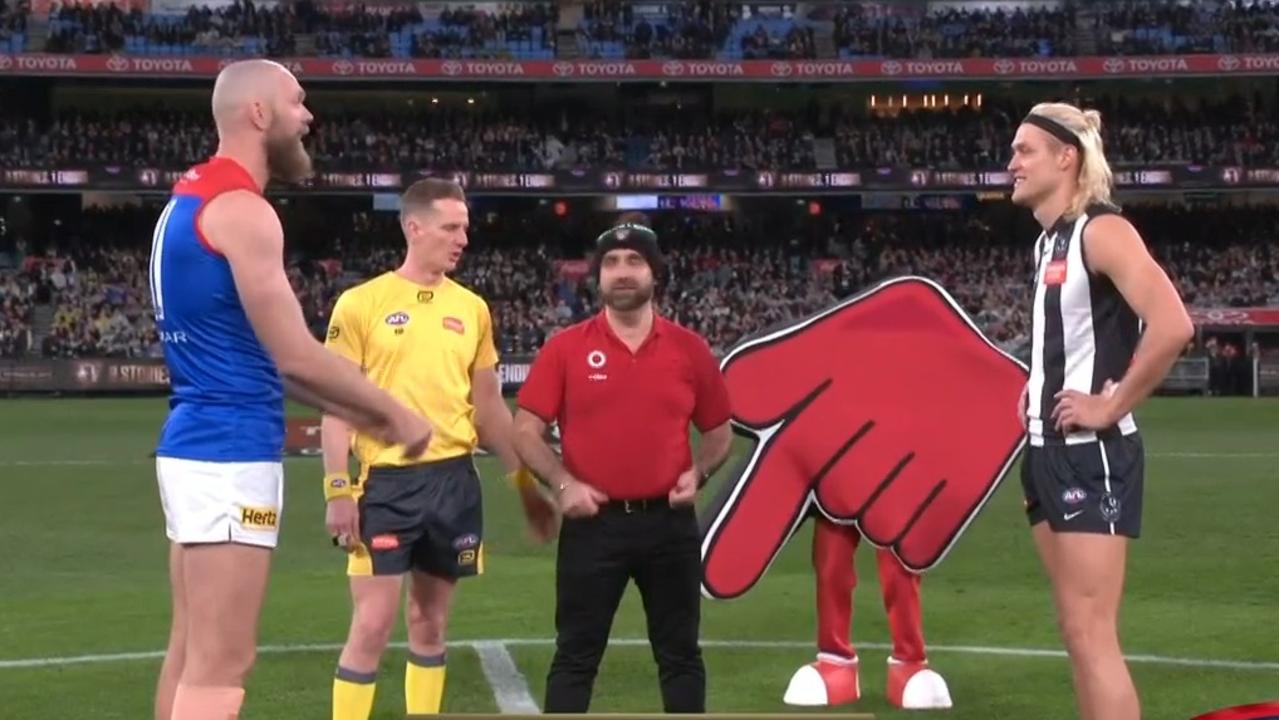 The coin was tossed in front of a Coles emblem. Photo: Fox Footy.