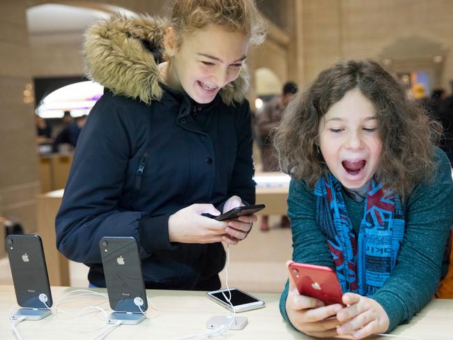 Shoppers check out the iPhone XR.