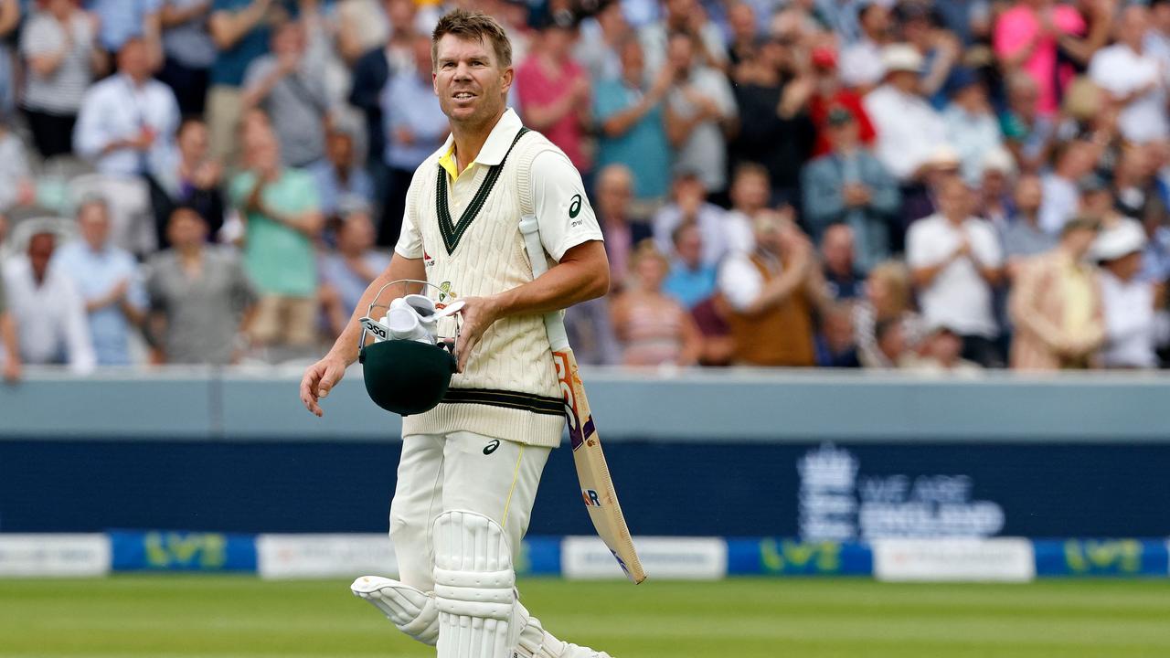 Australia's David Warner played through the pain for his vital half-century. Picture: AFP