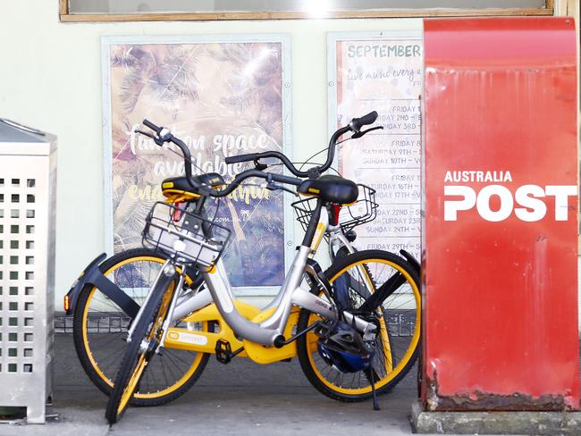 Hire bikes left on Coogee Bay Road near Coogee Beach. Many people are leaving the bikes not at designated bike sites. Picture: John Appleyard