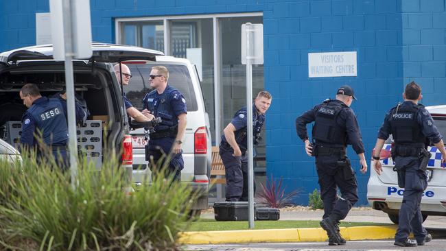 Police worked to bring the prisoners down from the roof. Picture: Jay Town