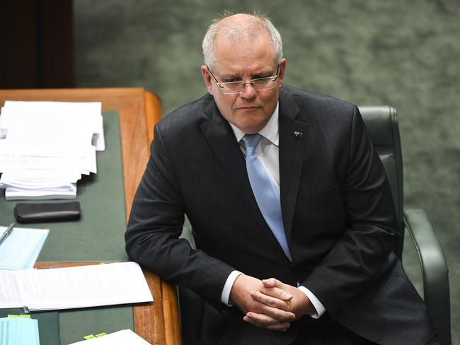 Australian Prime Minister Scott Morrison reacts during House of Representatives Question Time at Parliament House in Canberra, Wednesday, April 8, 2020. (AAP Image/Lukas Coch) NO ARCHIVING