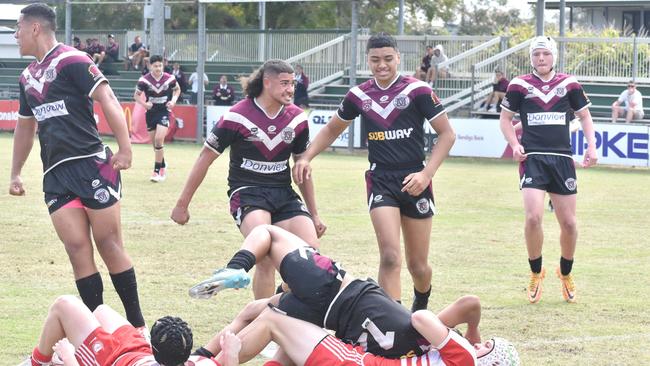 Mace Andrew, left, celebrates a try.