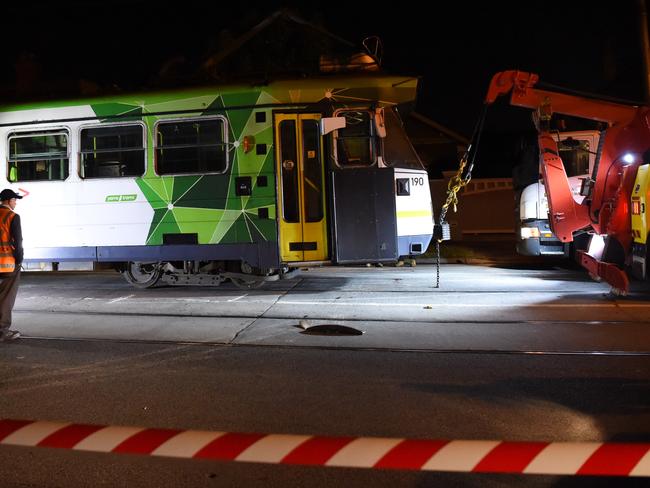 The tram is towed pulled back onto the tracks. Picture: Nicole Garmston