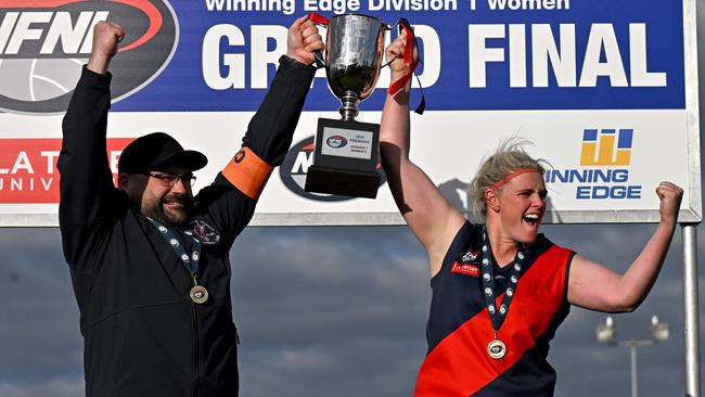 NFL: Diamond Creek Women’s coach Colin Wallington and captain Stacey Cross with the premiership cup. Picture: Andy Brownbill