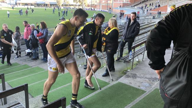 Sydney Stack, on crutches, hits the change rooms.