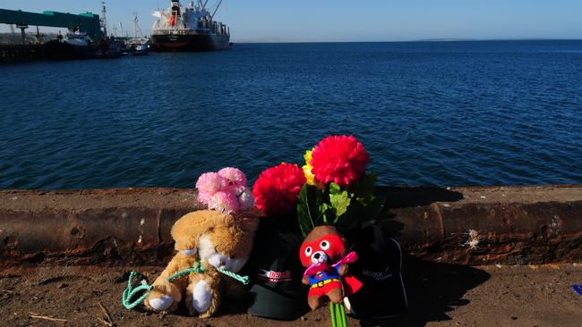 Tributes left at the wharf after the horrific deaths. Picture: Ivon Perrin