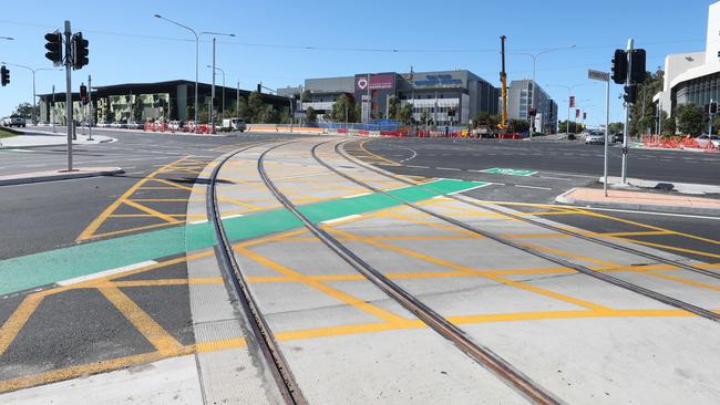 The light rail track running through a busy junction at Olsen Ave in Parkwood. Photo by Richard Gosling