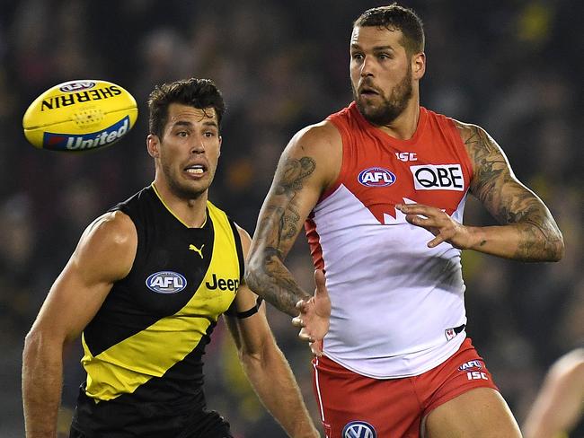 Lance Franklin of the Swans (right) and Alex Rance the Tigers contest during the Round 15 AFL match between the Richmond Tigers and the Sydney Swans at Etihad Stadium in Melbourne, Thursday, June 28, 2018. (AAP Image/Julian Smith) NO ARCHIVING, EDITORIAL USE ONLY