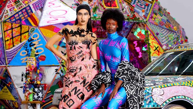 Mali Alexiou and Akelo model Romance Was Born designs in front of an artwork by Paul Yore at Carriageworks in Sydney. Picture: Jane Dempster