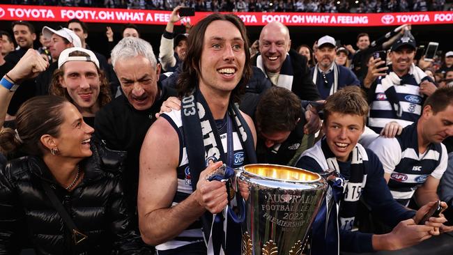 MELBOURNE, AUSTRALIA - SEPTEMBER 24: Jack Henry of the Cats celebrates with fans after winning the 2022 AFL Grand Final match between the Geelong Cats and the Sydney Swans at the Melbourne Cricket Ground on September 24, 2022 in Melbourne, Australia. (Photo by Cameron Spencer/AFL Photos/via Getty Images)