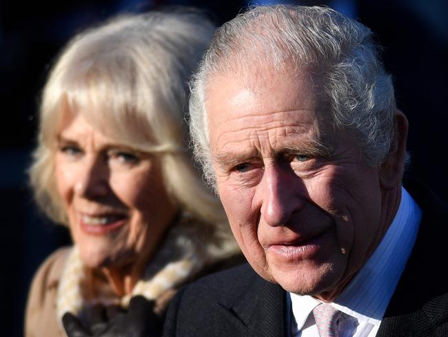 (FILES) In this file photo taken on January 20, 2023 Britain's King Charles III and Britain's Camilla, Queen Consort leave after visiting Bolton Town Hall in Bolton, north west England. - Charles III arrives in France on Sunday, March 26, for his first state visit as king, but the planned celebrations of historic cross-Channel relations face potential disruption from protests over unpopular pension reforms. (Photo by Oli SCARFF / AFP)