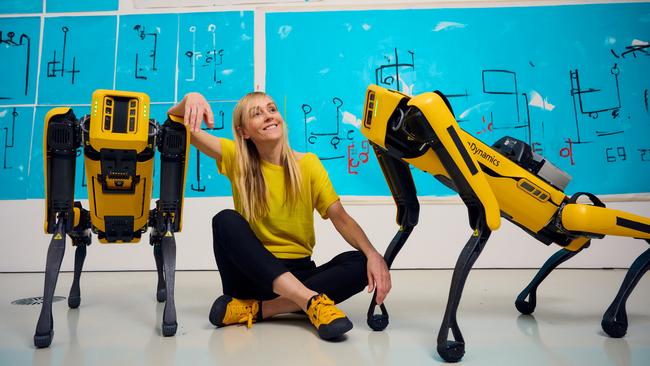 Agnieszka Pilat with her quadruped robot dogs, Bonnie Spot and Basia Spot, at the National Gallery of Victoria for the 2023 NGV Triennial exhibition in December. Picture: Eugene Hyland