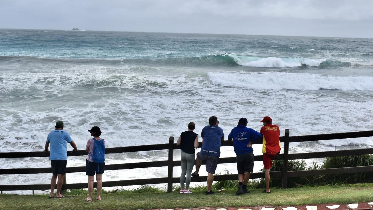 Main beach in Byron Bay remained closed but many visitors and residents decided to go and check out the high tide on Tuesday morning.