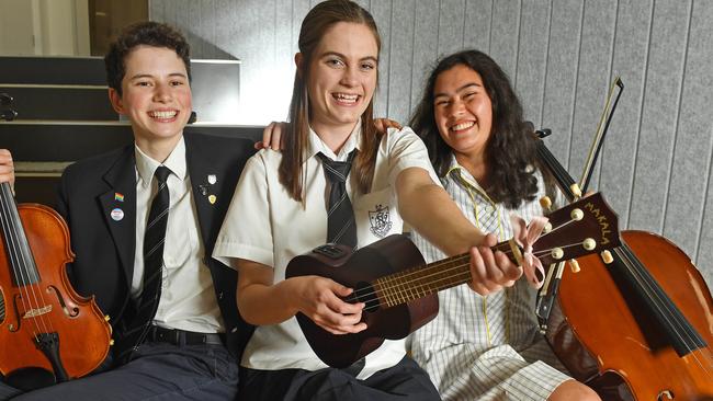 Adelaide High School student Samantha Timcke's (centre) song Paper People won two national awards in the Australian Children’s Music Foundation’s National Songwriting Competition. Pictured playing her song with fellow students Imogen Wearing and Ingrid Asenstorfer. Picture: Tom Huntley