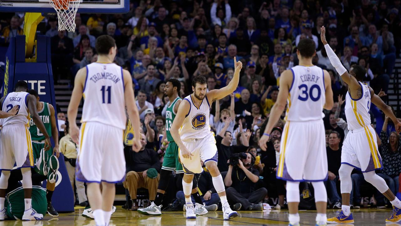 OAKLAND, CA - JANUARY 25: Andrew Bogut #12 of the Golden State Warriors reacts after he made a basket against the Boston Celtics at ORACLE Arena on January 25, 2015 in Oakland, California. NOTE TO USER: User expressly acknowledges and agrees that, by downloading and or using this photograph, User is consenting to the terms and conditions of the Getty Images License Agreement. Ezra Shaw/Getty Images/AFP == FOR NEWSPAPERS, INTERNET, TELCOS & TELEVISION USE ONLY ==