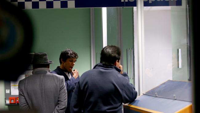 Kamer Nizamdeen pictured in Gordon police station checking in as part of his bail conditions. Picture by Damian Shaw