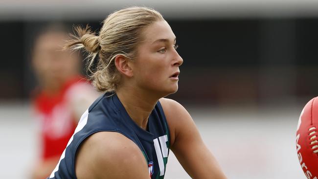 MELBOURNE, AUSTRALIA - APRIL 06:  Ash Centra of the AFL National Academy Girls handballs during the Marsh AFL National Academy Girls vs U23 All-Stars at Ikon Park on April 06, 2024 in Melbourne, Australia. (Photo by Darrian Traynor/AFL Photos/via Getty Images)