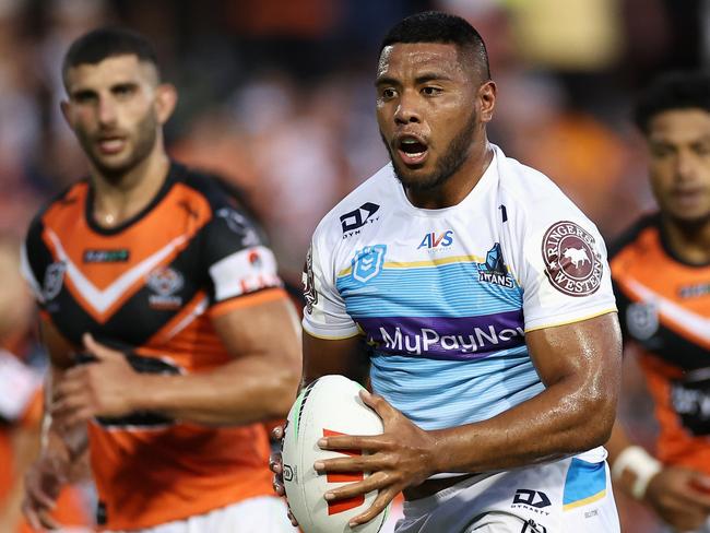 SYDNEY, AUSTRALIA - MARCH 05: Moeaki Fotuaika of the Titans runs the ball during the round one NRL match between the Wests Tigers and the Gold Coast Titans at Leichhardt Oval on March 05, 2023 in Sydney, Australia. (Photo by Cameron Spencer/Getty Images)