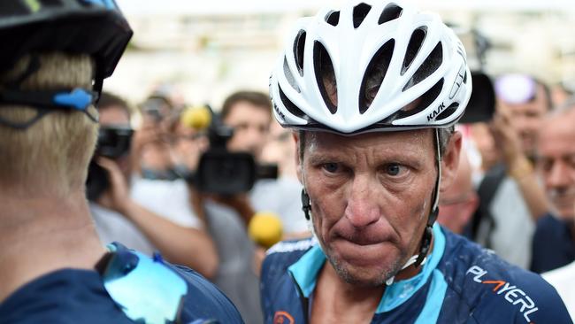 US cyclist Lance Armstrong looks on upon his arrival in Rodez, southwest France.