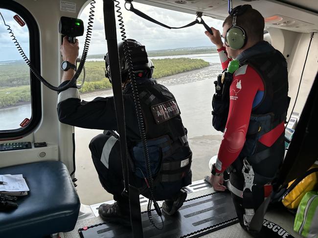 Rescue crews returned to the scene where a man was saved after becoming stuck in mud in Moreton bay. Picture: QAS