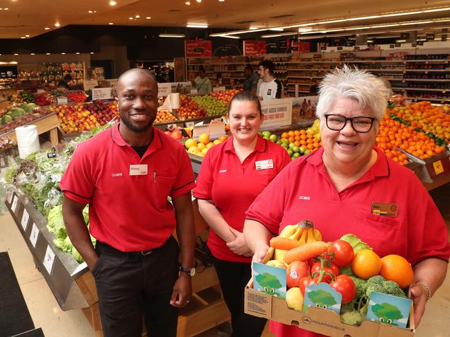 The Entrance Coles were all smiles to learn the store had come third in NSW in fundraising for the SecondBite campaign. Photo: Sue Graham