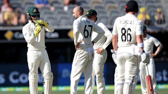 Tim Paine successfully calls for a DRS challenge for LBW on Tom Latham in the first Test. Picture: AAP