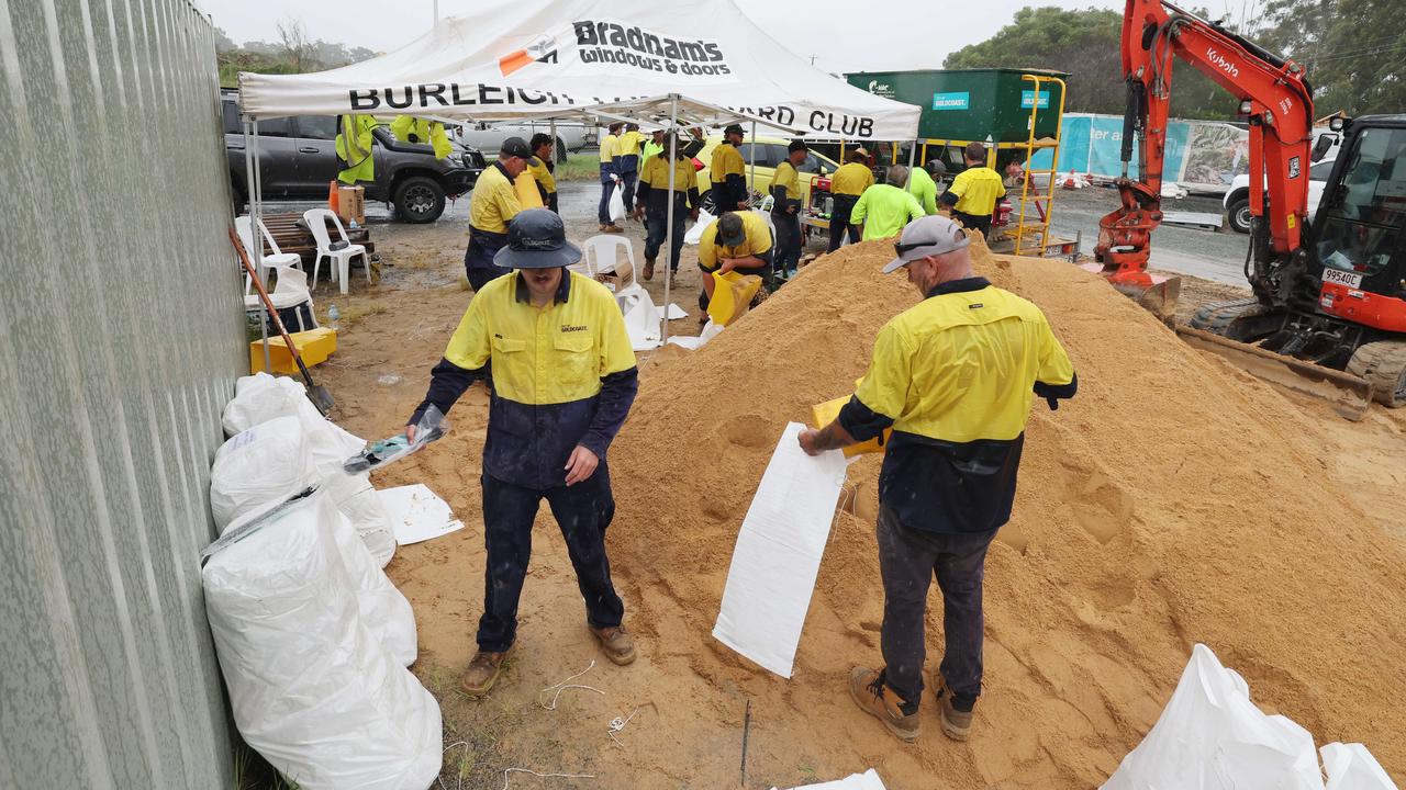 Panic buying and sandbagging queues stretch for hours