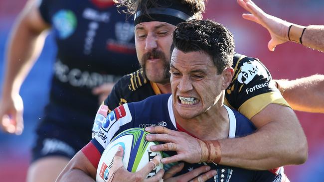 NEWCASTLE, AUSTRALIA - SEPTEMBER 05: Matt Toomua of the Rebels is tackled during the round 10 Super Rugby AU match between the Melbourne Rebels and the Western Force at McDonald Jones Stadium on September 05, 2020 in Newcastle, Australia. (Photo by Jason McCawley/Getty Images)