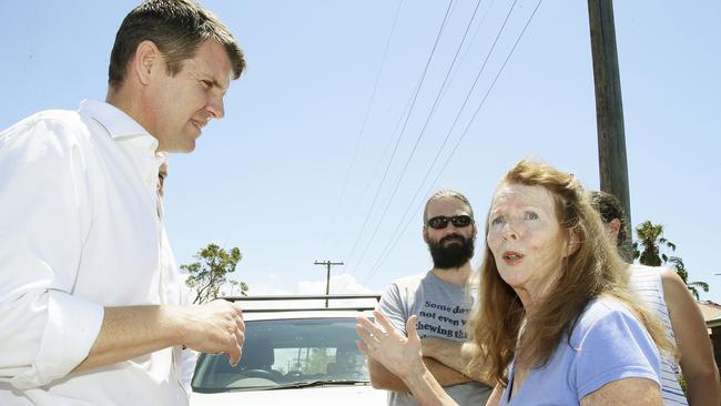 Premier Mike Baird speaks with Lynette Curran while touring tornado damage after a tornado swept through Kurnell in Sydney’s south yesterday. Picture: John Appleyard