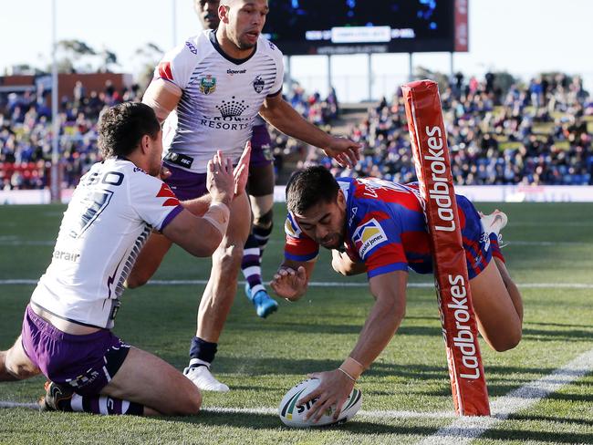 Ken Sio crosses the stripe for Newcastle in 2018. (AAP Image/Darren Pateman)