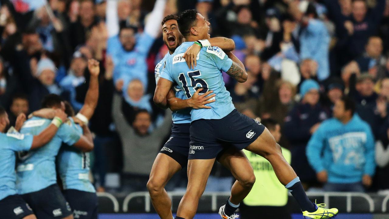 Waratahs Israel Folau celebrates victory at full time in the Waratahs v Crusaders Super Rugby Final at ANZ Stadium, Sydney. Pic Brett Costello