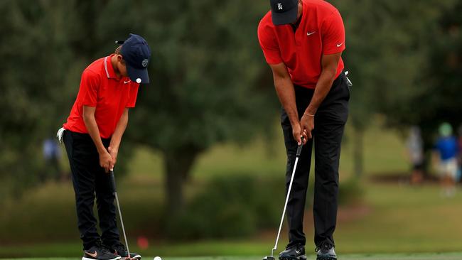 Double trouble in Florida as Tiger Woods and his son Charlie both wear the Sunday red before finishing seventh at the PNC Championship in Florida. Mike Ehrmann/Getty Images/AFP