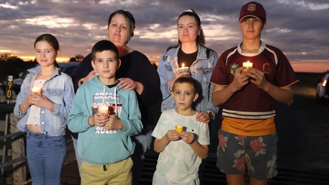 Blackwater residents holding candles in honour of local miner Nathan Turner, 30, who died this week, later testing positive to the novel coronavirus. Photo: Steve Vit