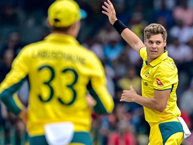 Australia's Spencer Johnson (R) celebrates after taking the wicket of Sri Lanka's Pathum Nissanka during the first one-day international (ODI) cricket match between Sri Lanka and Australia at R. Premadasa International Cricket Stadium in Colombo on February 12, 2025. (Photo by Ishara S. KODIKARA / AFP)