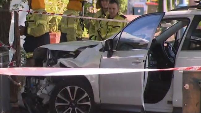 A woman has allegedly tried to run a man down before crashing her car onto a busy North Adelaide footpath. Picture: NINE NEWS