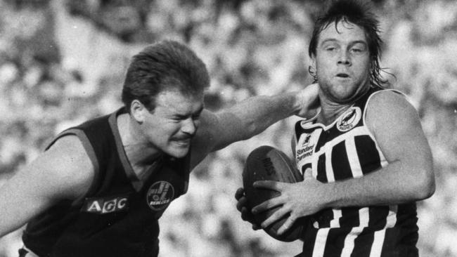 Port Adelaide's David Baker (right) incurs the attention of Norwood's Craig Balme in 1985.