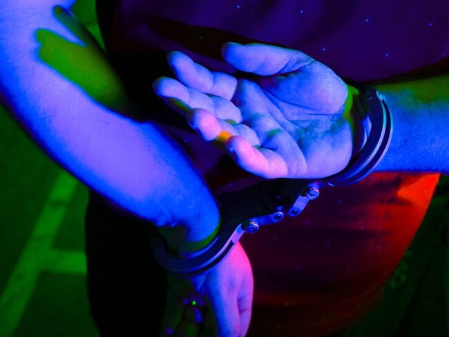 Cairns police generic handcuffs night