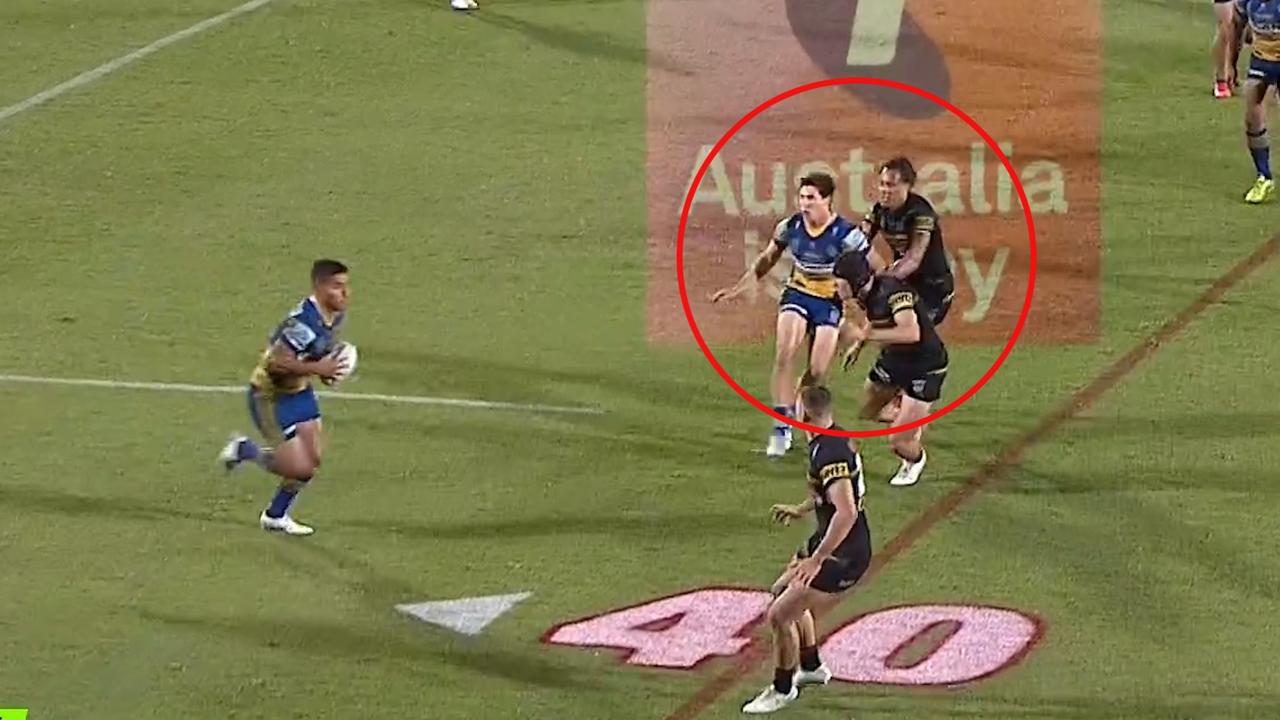 Mitch Moses is held back by Jarome Luai.