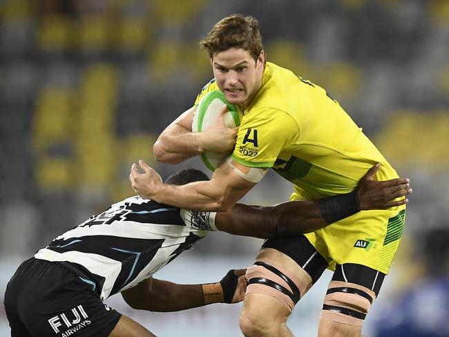 TOWNSVILLE, AUSTRALIA - JUNE 26: Tim Anstee of Australia is tackled during the Oceania Sevens Challenge match between Fiji and Australia at Queensland Country Bank Stadium on June 26, 2021 in Townsville, Australia. (Photo by Ian Hitchcock/Getty Images)