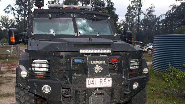 QLD Police SERT vehicle parked at the Wieambilla property with gunshots to the windows.