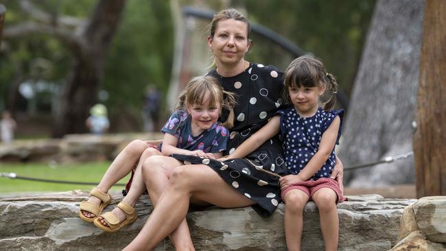 Petra Holbrook with her twin daughters Ellie and Ava, 4. Picture: Naomi Jellicoe