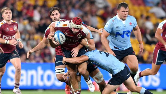 Reds star Fraser McReight takes on the Waratahs defence. Picture: Bradley Kanaris/Getty Images