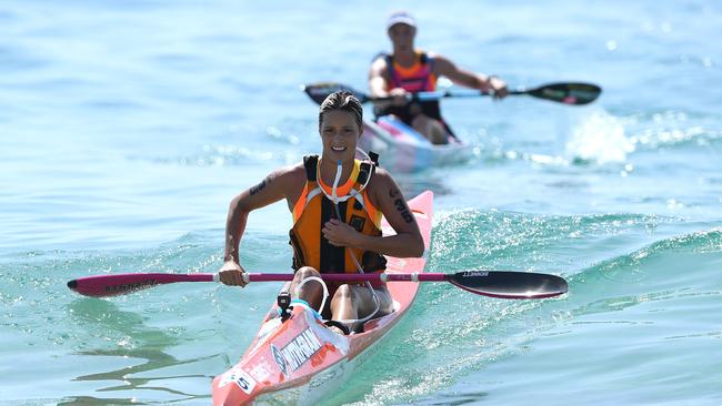 Courtney Hancock completes the ski leg of the Coolangatta Gold iron women race at Coolangatta Beach, Coolangatta, Sunday, October 8, 2017. (AAP Image/Dave Hunt)