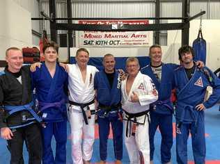 BELT GRADING: Celebrating after the recent Brazilian jiu jitsu grading at Ka-chi Mixed Martial Arts are (from left) Curtis Evans, Kahn Asgill, professor Vincent Perry, Elijah Kennedy, professor Joe Perry, Steve Prigg and Tim Eaton. Picture: Sean White