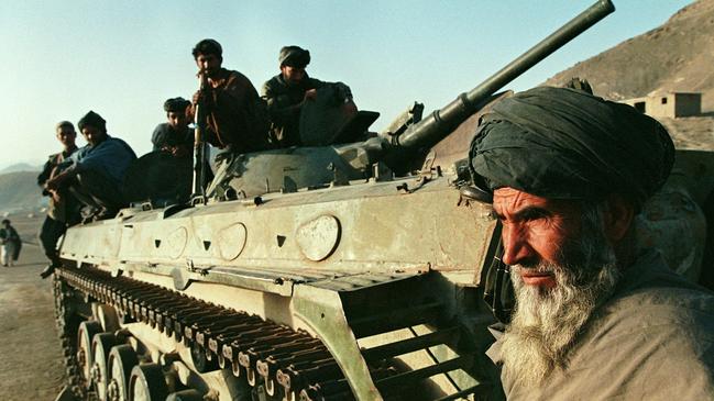 War zone … Taliban fighters advance in Afghanistan, 1997.