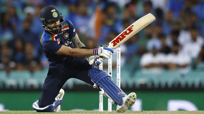 Indian captain Virat Kohli sweeps for six during at the SCG. Picture. Phil Hillyard