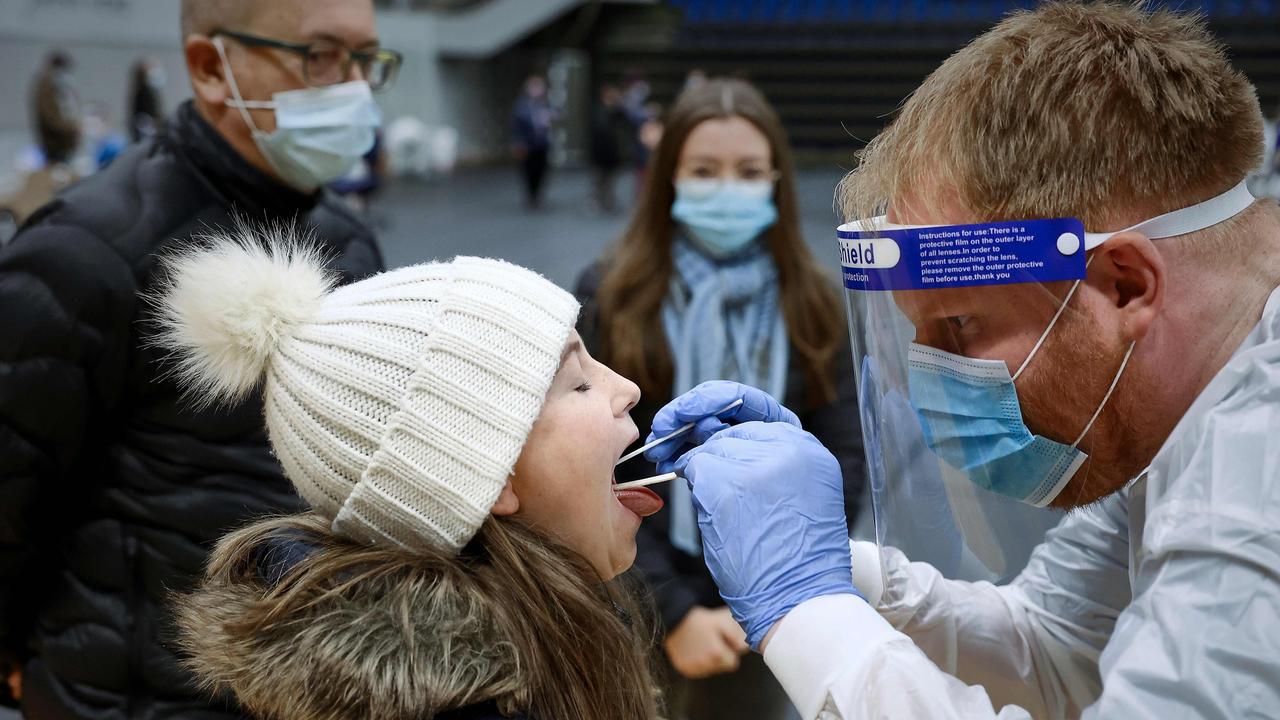 A child opens her mouth as she is being tested for coronavirus COVID-19 during a mass testing in the Arena Nord in Frederikshavn, in Northern Jutland, Denmark, last year. Picture: Claus Bjoern Larsen/Ritzau Scanpix/AFP