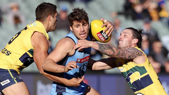 James Battersby under pressure from Jared Petrenko and James Boyd. Picture: Sarah Reed