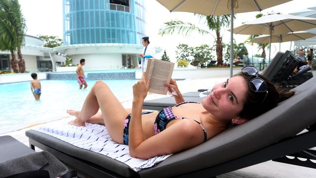 Ellen Hill from Melbourne relaxing poolside on her Cairns holiday. PICTURE: STEWART MCLEAN